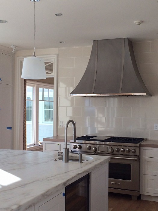 Custom range hoods and counter tops